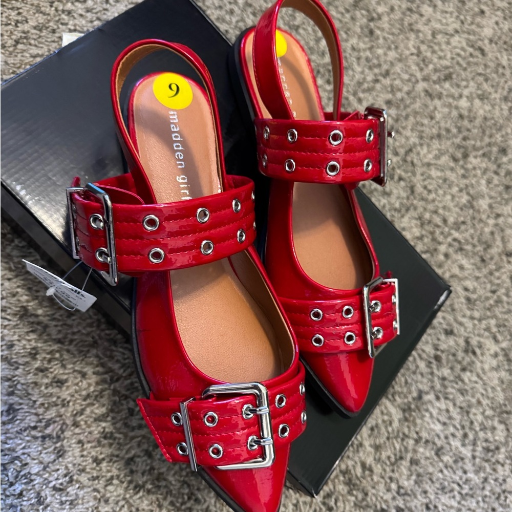 Brand new red flats with tags.